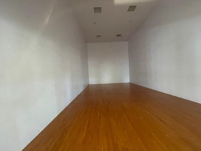7896 Sonoma Springs Cir Unit 204, Lake Worth, FL 33463 - spare room featuring visible vents and wood finished floors
