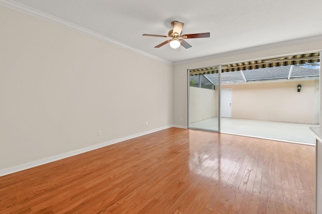 unfurnished bedroom featuring crown molding, baseboards, light wood finished floors, and ceiling fan