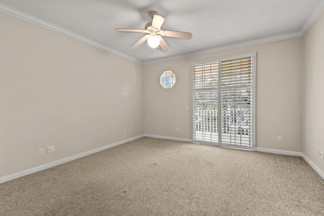 carpeted empty room with a ceiling fan, baseboards, and ornamental molding