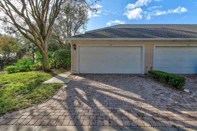 114 Radcliffe Ct, Jupiter, FL 33458 - garage featuring decorative driveway