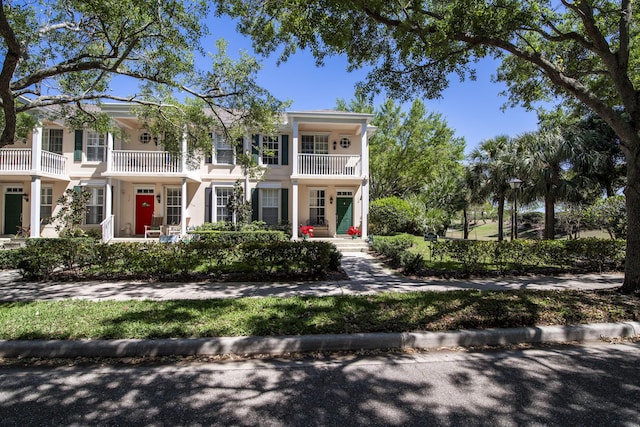 114 Radcliffe Ct, Jupiter, FL 33458 - view of front facade with a balcony and stucco siding