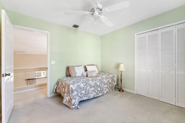 bedroom with visible vents, a ceiling fan, a closet, carpet, and baseboards