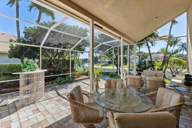 view of patio featuring a lanai