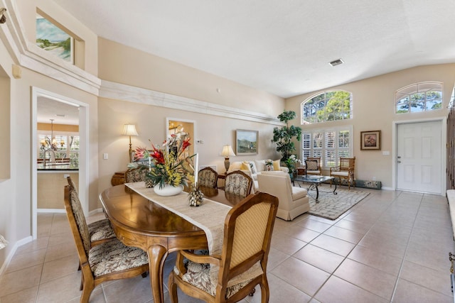 dining room with visible vents, plenty of natural light, baseboards, and light tile patterned flooring