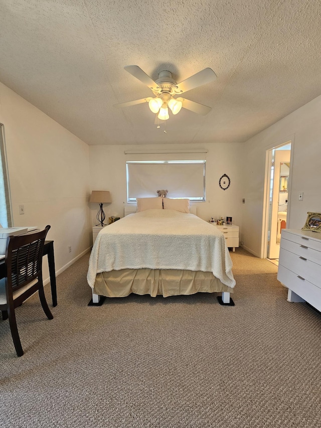 bedroom with a textured ceiling, a ceiling fan, baseboards, and light carpet