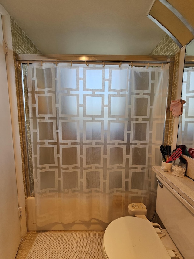 bathroom with toilet and shower / bathtub combination with curtain