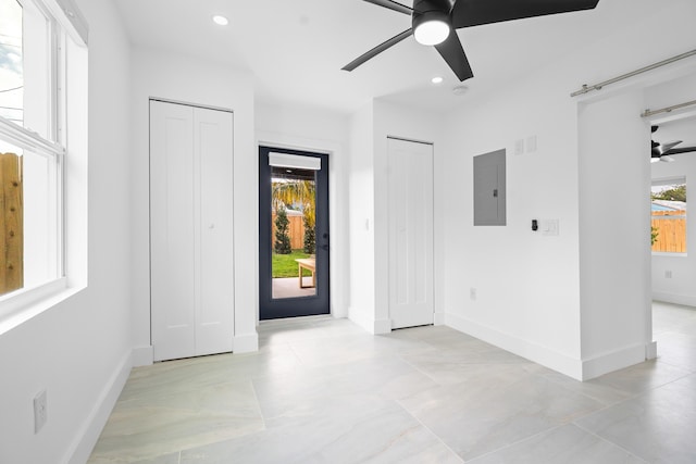 unfurnished room with electric panel, baseboards, ceiling fan, and recessed lighting