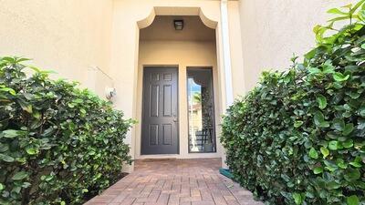 property entrance with stucco siding