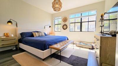 bedroom featuring dark wood-type flooring and lofted ceiling