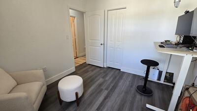 interior space featuring dark wood finished floors and baseboards