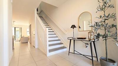 stairway with tile patterned flooring