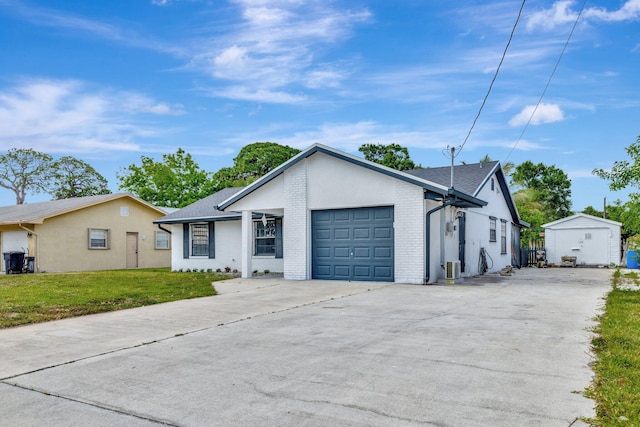 ranch-style home featuring concrete driveway, brick siding, an attached garage, and a front lawn