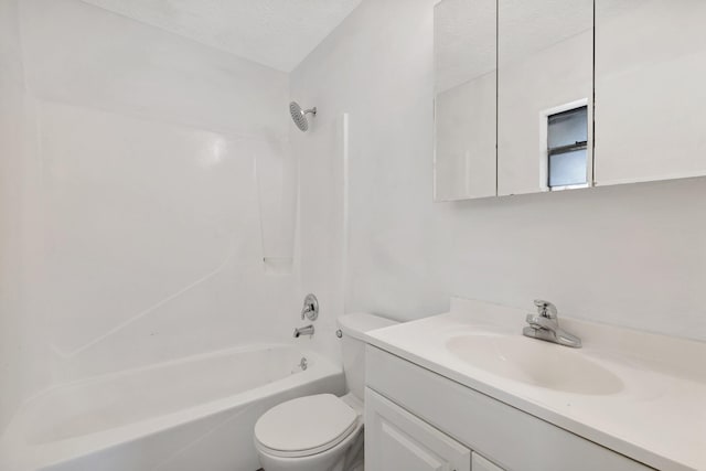 full bath featuring vanity, toilet, a textured ceiling, and shower / washtub combination