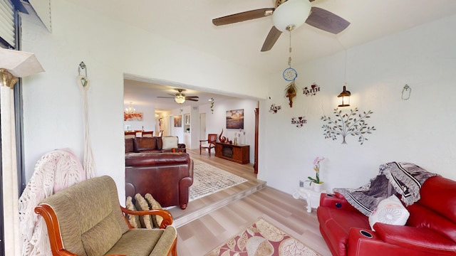 living area with ceiling fan and light wood-style floors