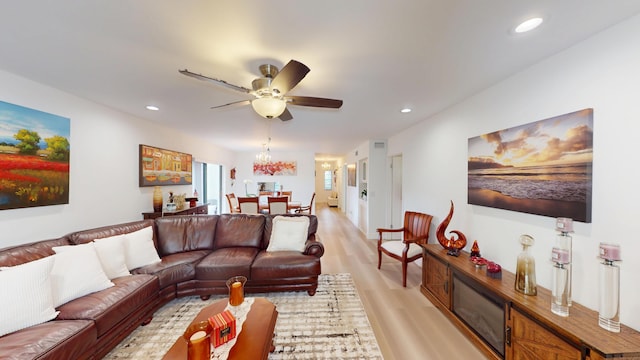 living area featuring recessed lighting, light wood-style floors, and ceiling fan