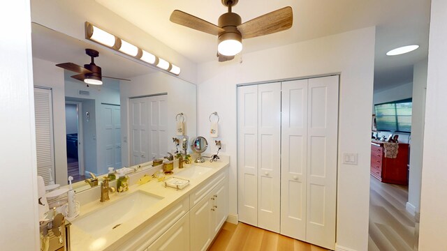 bathroom featuring a closet and ceiling fan