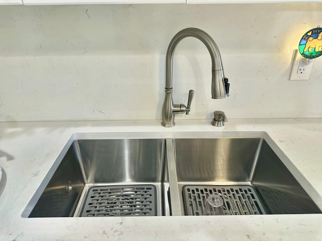 interior details featuring a sink