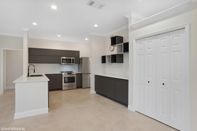 kitchen with visible vents, modern cabinets, a sink, appliances with stainless steel finishes, and light countertops