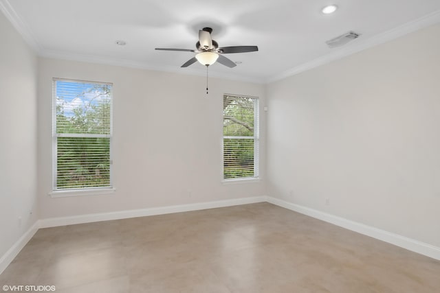 spare room featuring crown molding, baseboards, and visible vents