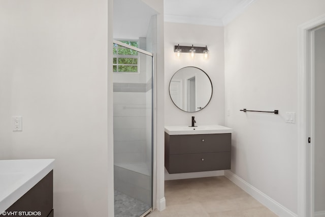 bathroom featuring a stall shower, vanity, baseboards, and ornamental molding