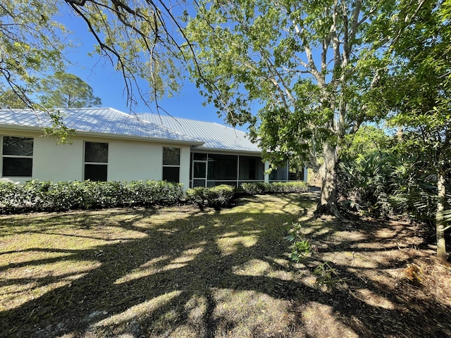 view of yard featuring a sunroom