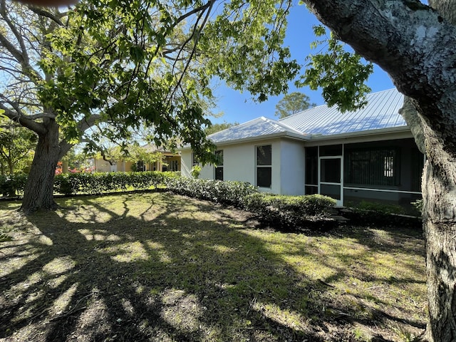 view of yard with a sunroom