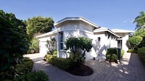 view of home's exterior featuring decorative driveway