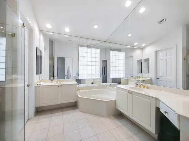 bathroom with visible vents, two vanities, a sink, recessed lighting, and a bath