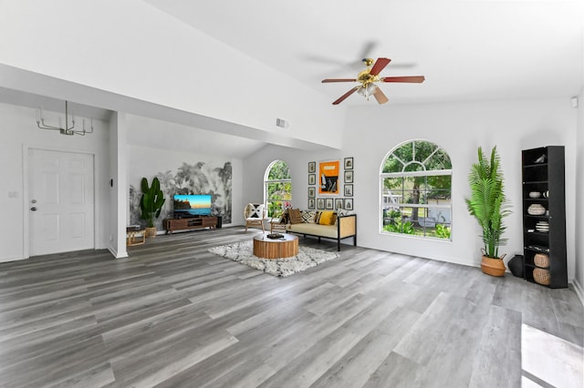 7492 SW 40th Ter, Palm City, FL 34990 - living area with healthy amount of natural light, a ceiling fan, wood finished floors, and vaulted ceiling
