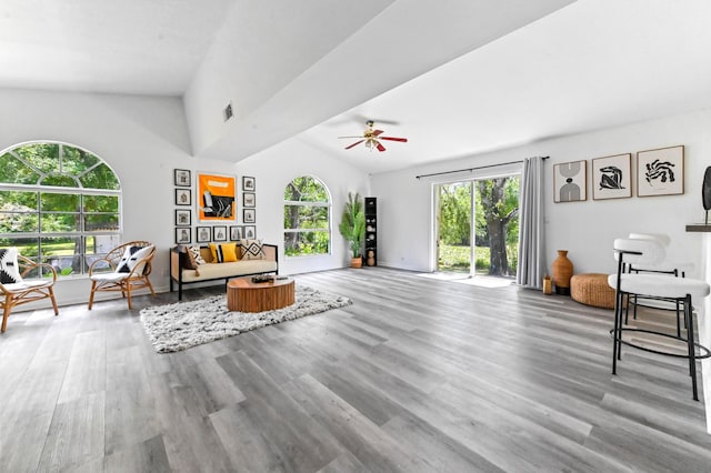 7492 SW 40th Ter, Palm City, FL 34990 - living room with lofted ceiling, wood finished floors, a ceiling fan, and baseboards