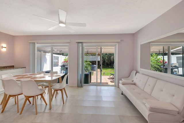 dining space with a healthy amount of sunlight and ceiling fan