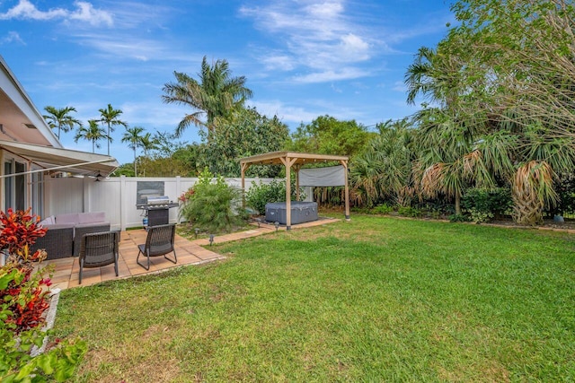 view of yard with a fenced backyard, a hot tub, a patio, and an outdoor hangout area