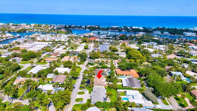bird's eye view with a water view and a residential view