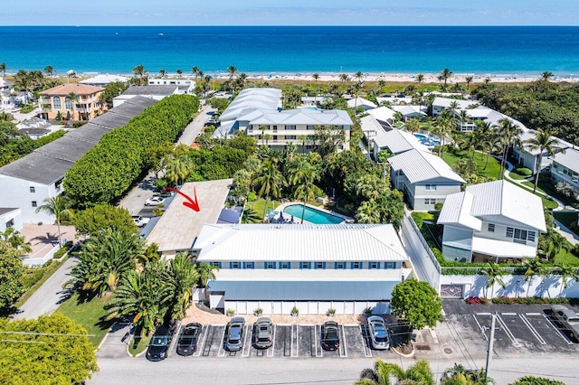 birds eye view of property featuring a residential view, a view of the beach, and a water view