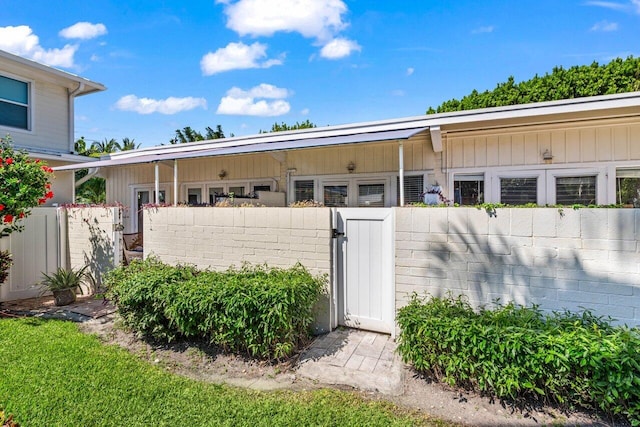 exterior space featuring a gate and fence