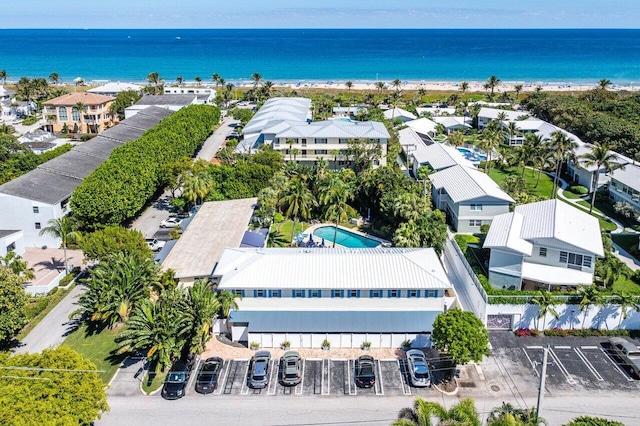 bird's eye view featuring a residential view, a water view, and a beach view