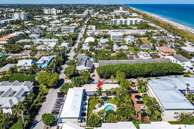 drone / aerial view featuring a view of the beach and a water view