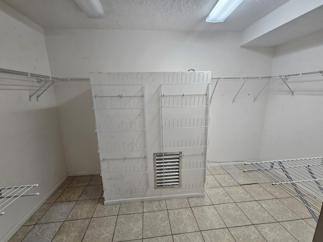 walk in closet featuring tile patterned floors