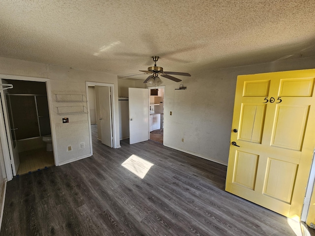 unfurnished bedroom with a closet, a textured ceiling, and dark wood finished floors