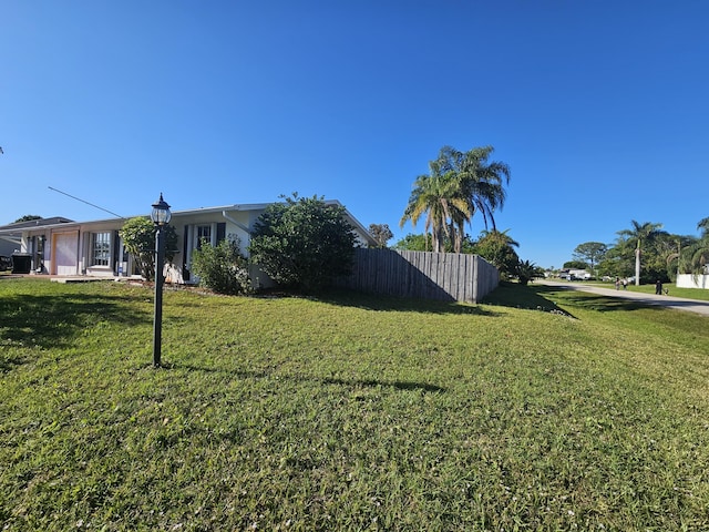 view of yard featuring fence