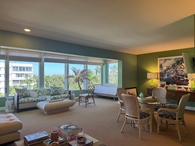 dining space featuring recessed lighting and carpet