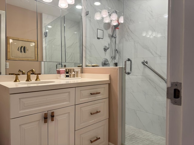 bathroom with a stall shower and vanity