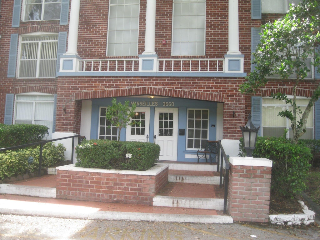 exterior space with brick siding