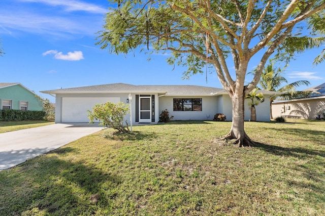 single story home with stucco siding, a front lawn, concrete driveway, and a garage