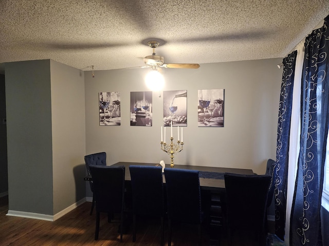 dining room with baseboards, a textured ceiling, wood finished floors, and a ceiling fan