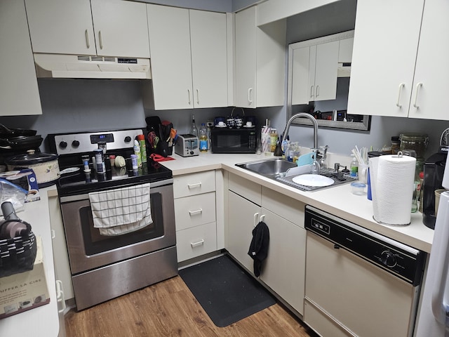 217 SE Village Dr Unit 217, Port Saint Lucie, FL 34952 - kitchen featuring dishwasher, under cabinet range hood, electric stove, a sink, and black microwave