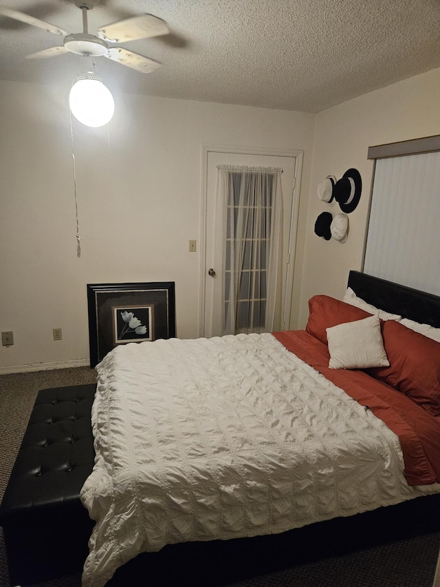 217 SE Village Dr Unit 217, Port Saint Lucie, FL 34952 - bedroom featuring a ceiling fan and a textured ceiling