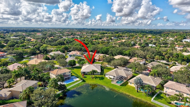 birds eye view of property with a residential view and a water view