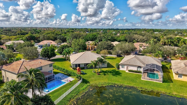 birds eye view of property with a forest view