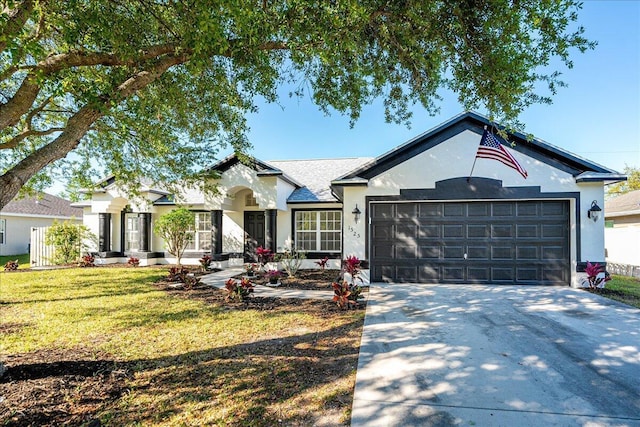 ranch-style house with stucco siding, concrete driveway, a garage, and a front yard